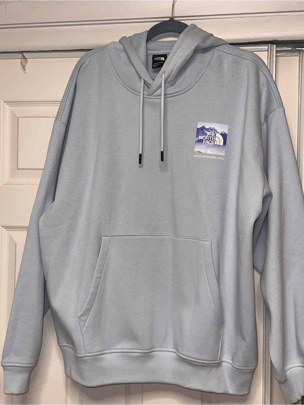 The North Face Pale Blue Pullover Hoodie with Small Chest Patch